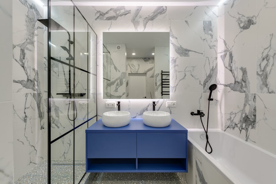 Professional bathroom remodeling contractor inspecting a new installation