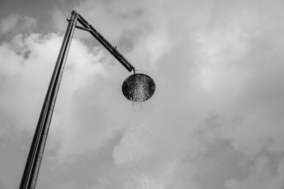 Premium rain shower head with luxury tile background